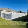 Beautiful Grey colored Vinyl Privacy Fence installation for this property!